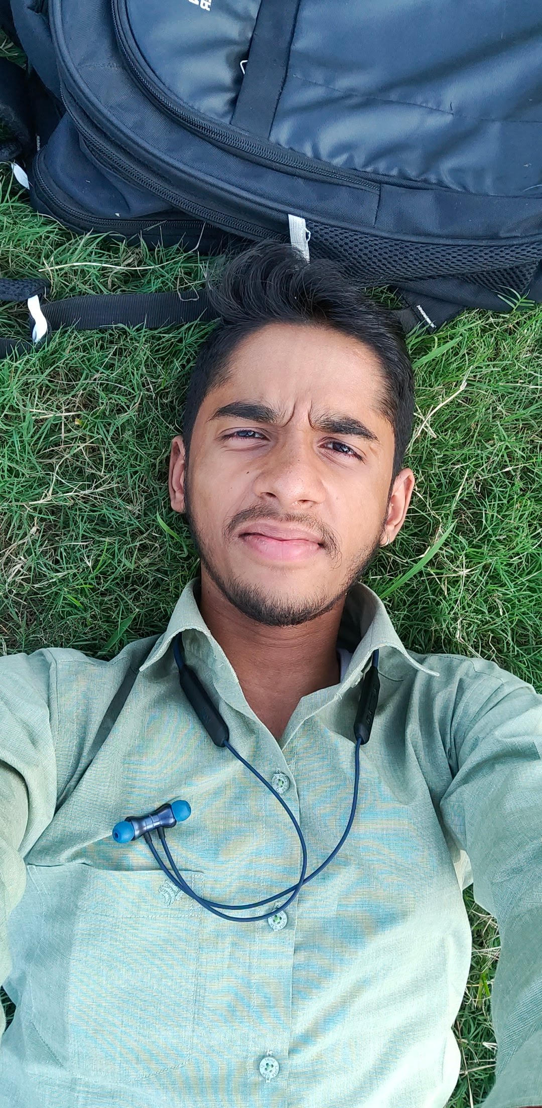 Candid of Arpit Tyagi laying on grass