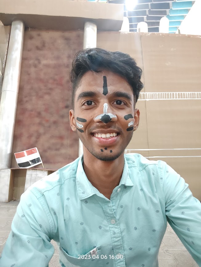 Arpit Tyagi smiling with colors on face